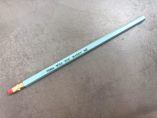 A pencil which says tessa will you marry me