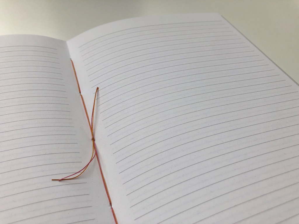 A notebook spread with lined paper.