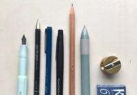 a selections of pens and pencils on a desk